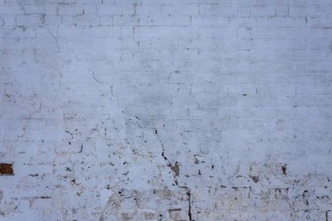 Texture of red brickwork with peeled white paint Foto stock