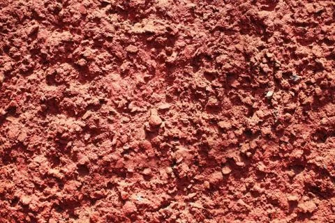 Texture of red bumpy cement wall Stock Photos