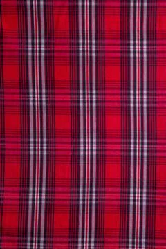 Texture of red checked fabric. The fabric of the red checked shirt. Stock Photos