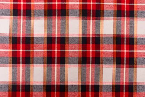 Texture of red checkered fabric. Checkered cotton background Stock Photos