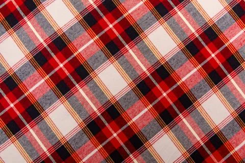 Texture of red checkered fabric. Checkered cotton background Stock Photos