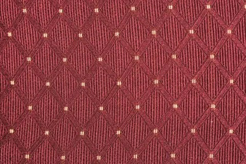 Texture of red fabric with rombic pattern with white dot Stock Photos