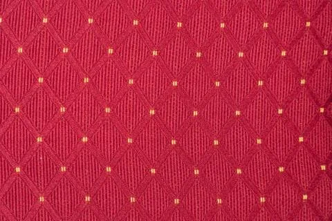 Texture of red fabric with rombic pattern with white dot Stock Photos