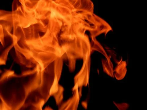 Texture of red fire flame on a black background Stock Photos