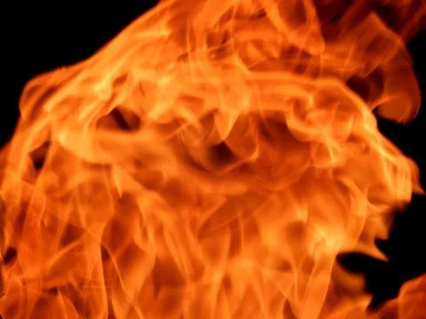 Texture of red fire flame on a black background Stock Photos