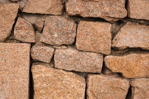 Texture of red granite wall as background Stock Photos