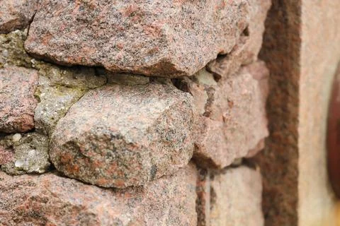 Texture of red granite wall as background, closeup Stock Photos
