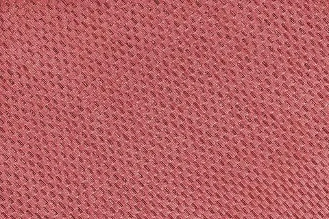 Texture of red jacquard fabric of diagonal rough weave cloth structure macr.. Stock Photos