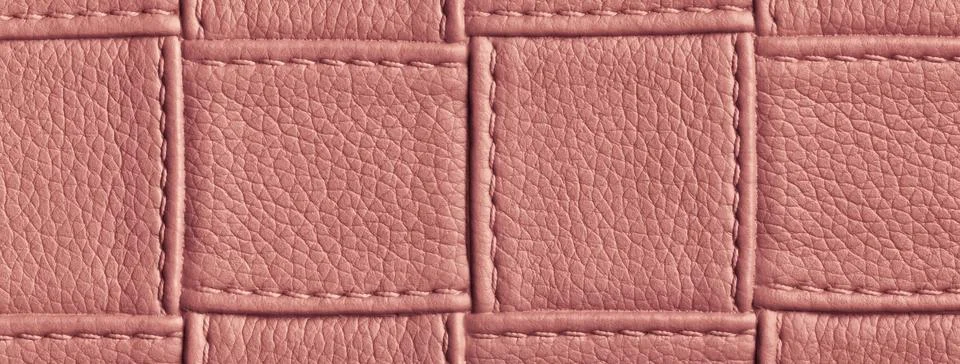 Texture red leather background with square pattern and stitch, macro. 스톡 사진