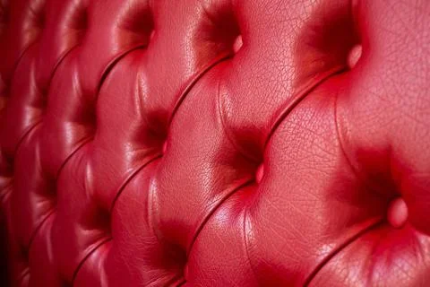 Texture of red leather sofa. Focus on the center Stock Photos