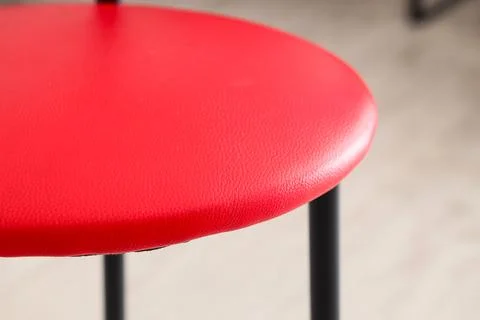 Texture of red leather stool in workshop, closeup Stock Photos