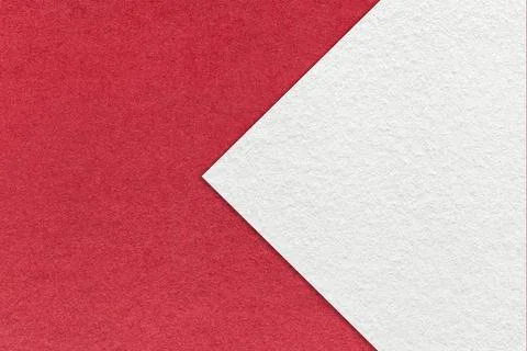 Texture of red paper background, half two colors with white arrow sign, macro 스톡 일러스트
