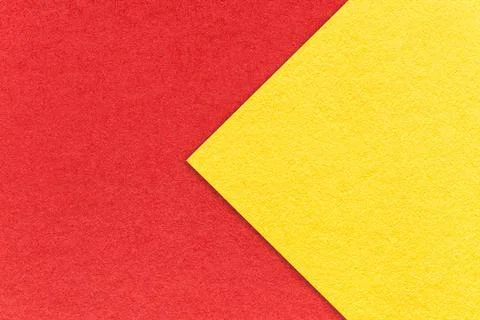 Texture of red paper background, half two colors with yellow arrow, macro. Foto stock