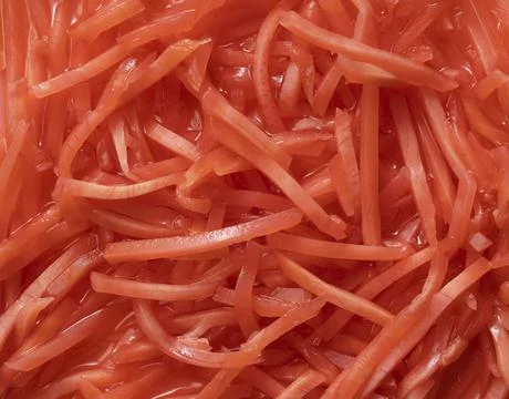 Texture of red pickled ginger. Stock Photos