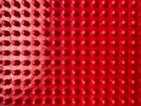 Texture,of red plastic with pimples close up, abstract background Stock Photos