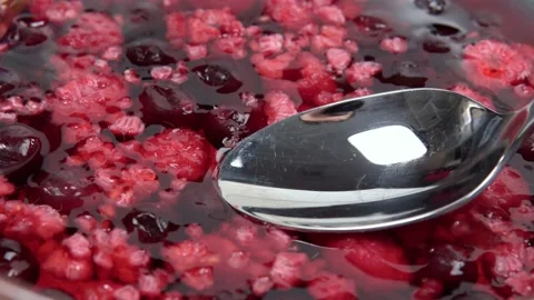 Texture of red raspberry jelly berries. from top to texture red background Stock Footage 147538192