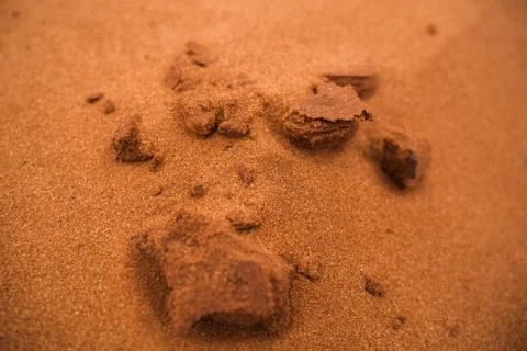 Texture of red sand with structures and small stones Stock Photos