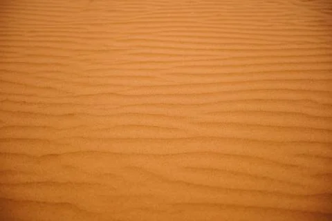 Texture of red sand with structures and small stones Foto stock