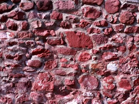 Texture of red stone wall background Stock Photos