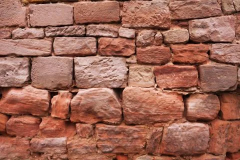 Texture of red stone wall. Stock Photos