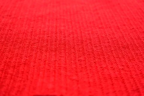 Texture of red wool knitted yarn, woolen fabric background Fotos Stock