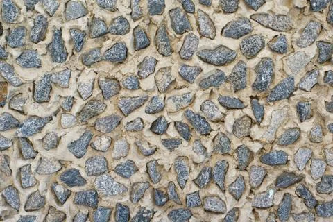 Texture of a relief wall from a large stone and concrete Stock Photos