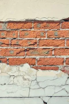 Texture of retro red brick wall with sprinkled stucco, concrete background, c Stock Photos