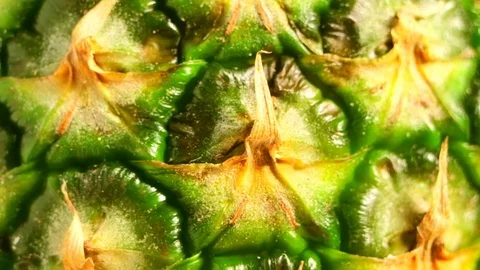 Texture of ripe pineapple close-up. Smooth rotation. A tropical fruit  Stock Footage 83860787