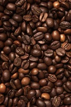 The texture of roasted aromatic coffee. Stock Photos