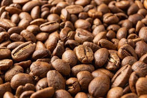 Texture of roasted coffee beans, aromatic and energy drink. Stock Photos