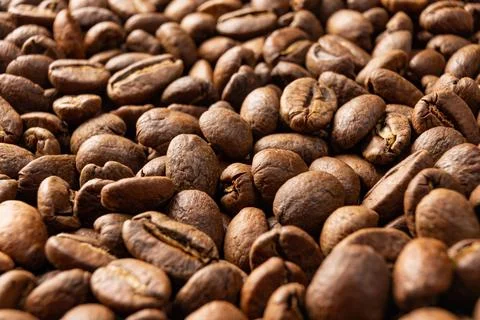 Texture of roasted coffee beans, aromatic and energy drink. Stockfoto's