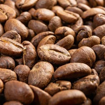 Texture of roasted coffee beans, aromatic and energy drink. Stock Photos