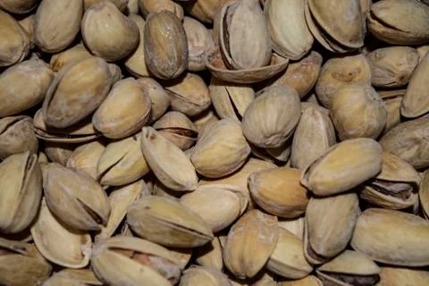 The texture is roasted with salt pistachios. Background image. Close up Stock Photos