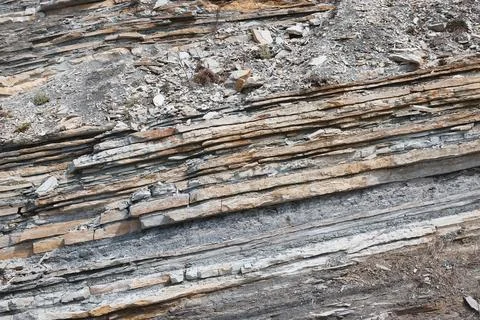 Texture of rock with different rocks, several layers of rock, close-up Fotos de archivo