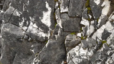 Texture of a rock - natural rough black and white stone Stock Footage 218565153