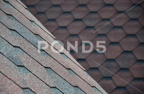 The texture of the roof with bituminous coating. Rough bituminous mosaic of r Stock Photos