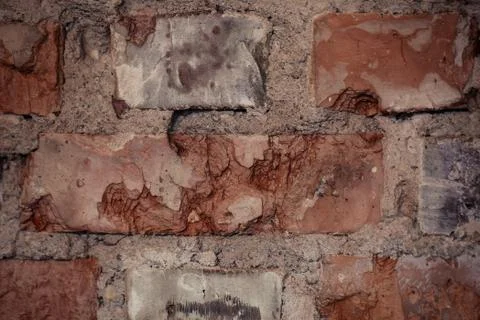 Texture of rough brick wall in old house. Background for design. Stock Photos