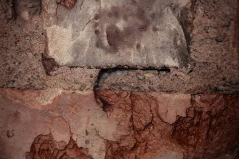 Texture of rough brick wall in old house. Background for design. Stock Photos