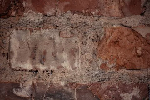 Texture of rough brick wall in old house. Background for design. Stock Photos