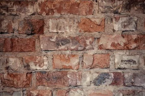 Texture of rough brick wall in old house. Background for design. Stock Photos