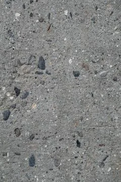 Texture of rough concrete wall with visible stones. Stock-Fotos