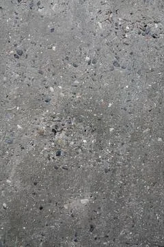 Texture of rough concrete wall with visible stones. Stock-Fotos