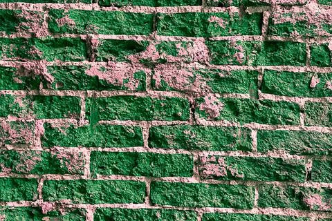 Texture rough green brick wall closeup Stock Photos