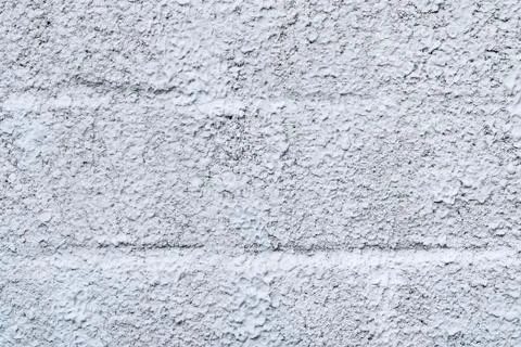 Texture of rough plaster on stone blocks, like a background Stock Photos