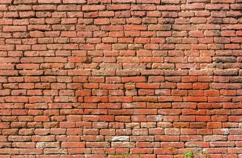 Texture of rough red brick wall Stock Photos