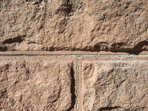 Texture of rough stonework made of tuff blocks Stock Photos
