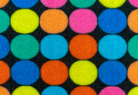 Texture of the rug with colored circles. Background for design and decoration. Stock Photos