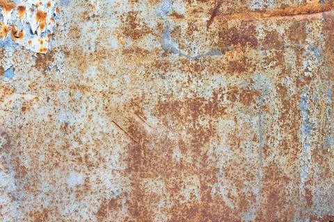 Texture of rust showing through on a painted metal old sheet with peeling pai Stock Photos