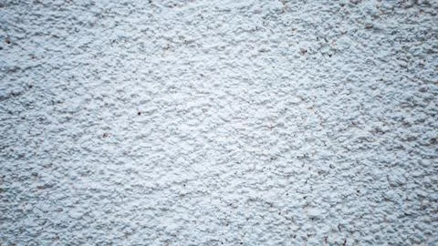 Texture of a rustic wall capturing sunlight gently in a serene setting with.. Stock Photos