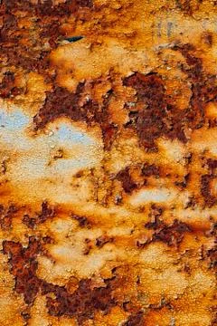 Texture of rusty iron, cracked paint on an old metallic surface, sheet of rus Stock Photos